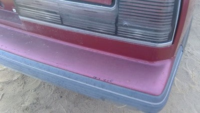 1990-1991 Olds Eighty Eight Tail Trim Panel Below Tail Lights Oem Red 25552895