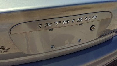 2000 Oldsmobile Intrigue License Plate Trim Surround Panel Tail Trunk Silver 17U