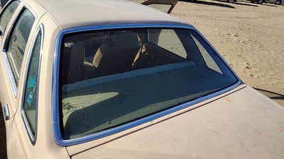1984 Ford Tempo Chrome Moulding Around Back Glass Oem