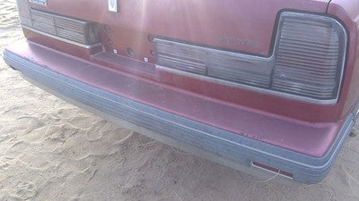 1990-1991 Olds Eighty Eight Tail Trim Panel Below Tail Lights Oem Red 25552895