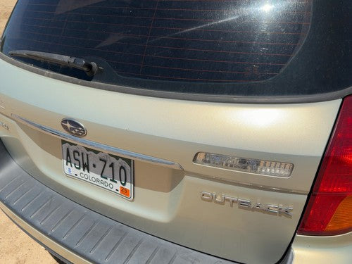 05-09 Legacy Outback License Plate Trim Surround Panel Tail Trunk Finish Gold 9J