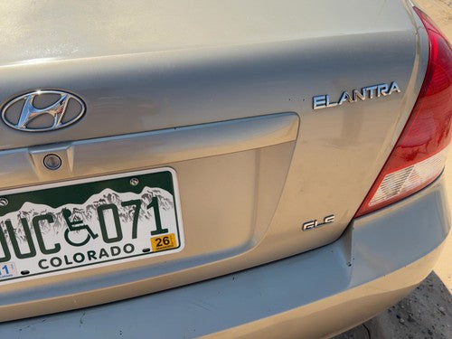 01-06 Elantra License Plate Trim Surround Panel Tail Trunk Finish Prime Beige Ko