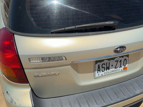05-09 Legacy Outback License Plate Trim Surround Panel Tail Trunk Finish Gold 9J