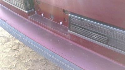 1990-1991 Olds Eighty Eight Tail Trim Panel Below Tail Lights Oem Red 25552895