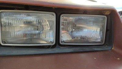 1985-1987 Pontiac Sunbird Driver Left Headlight Trim Bezel Oem Surround Door
