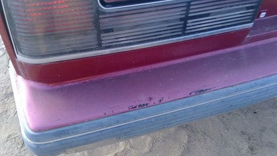 1990-1991 Olds Eighty Eight Tail Trim Panel Below Tail Lights Oem Red 25552895