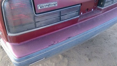 1990-1991 Olds Eighty Eight Tail Trim Panel Below Tail Lights Oem Red 25552895