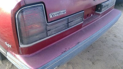 1990-1991 Olds Eighty Eight Tail Trim Panel Below Tail Lights Oem Red 25552895