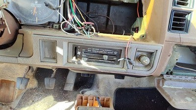 1985-1988 Pontiac Sunbird Lower Dash Under Column Knee Bolster Trim Panel Tan