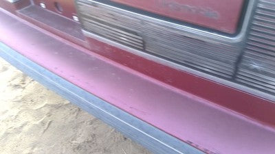 1990-1991 Olds Eighty Eight Tail Trim Panel Below Tail Lights Oem Red 25552895