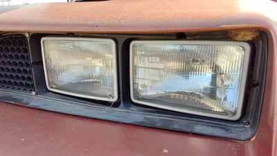 1985-1988 Pontiac Sunbird Driver Left Head Light Oem Front Lamp 10026819