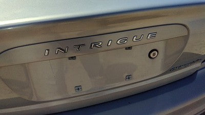 2000 Oldsmobile Intrigue License Plate Trim Surround Panel Tail Trunk Silver 17U