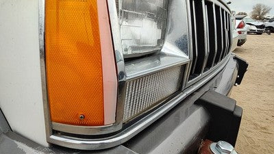 1991-1996 Jeep Cherokee Passenger Right Chrome Trim Around Headlight Oem