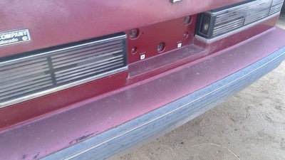 1990-1991 Olds Eighty Eight Tail Trim Panel Below Tail Lights Oem Red 25552895