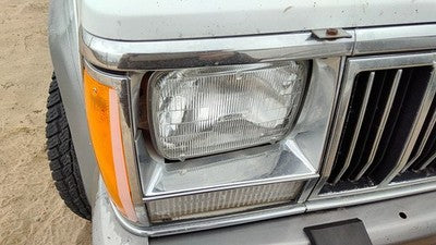 1991-1996 Jeep Cherokee Passenger Right Chrome Trim Around Headlight Oem