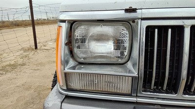 1991-1996 Jeep Cherokee Passenger Right Chrome Trim Around Headlight Oem