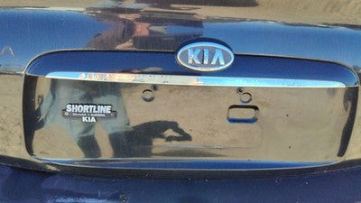 05 Kia Spectra License Plate Trim Surround Panel Tail Trunk Finish Black 4 Door