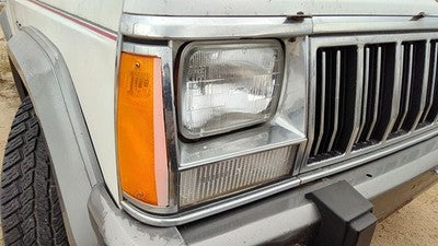 1991-1996 Jeep Cherokee Passenger Right Chrome Trim Around Headlight Oem