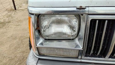 1991-1996 Jeep Cherokee Passenger Right Chrome Trim Around Headlight Oem