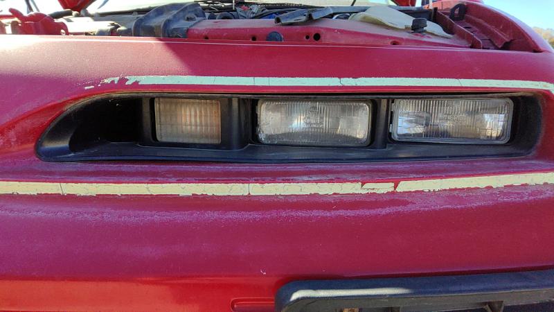 1991-1996 Grand Prix Headlight Door LH